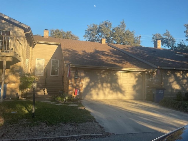 view of side of property with a garage