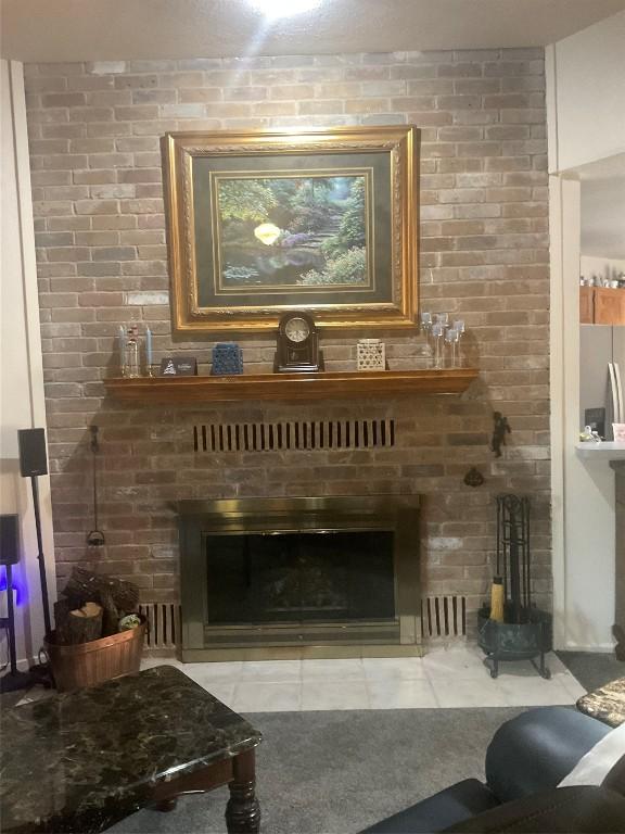 living room with carpet floors and a fireplace