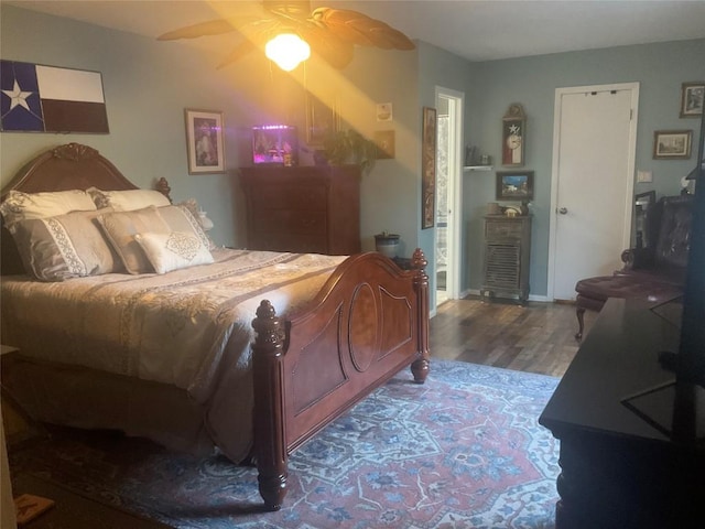 bedroom with ceiling fan and hardwood / wood-style floors