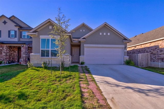 view of front facade with a garage and a front lawn