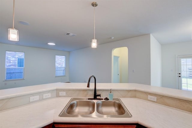 kitchen with pendant lighting and sink