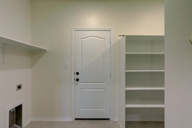 washroom with light tile patterned floors and hookup for an electric dryer