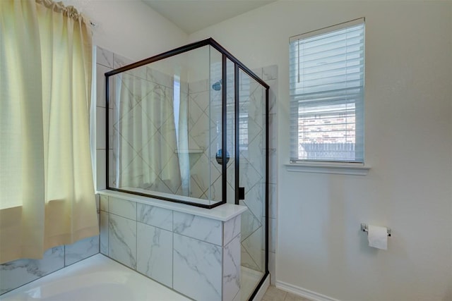 bathroom featuring independent shower and bath