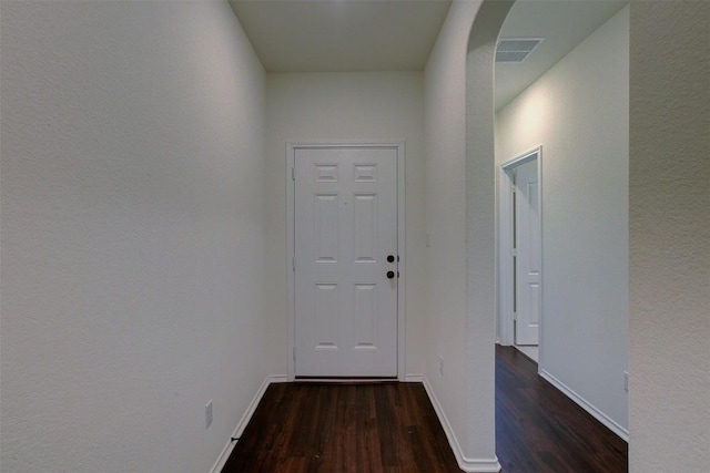 hallway featuring dark wood-type flooring