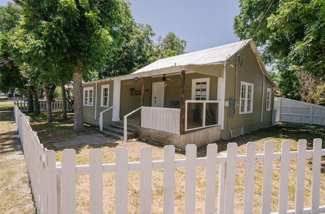 bungalow-style house featuring fence, covered porch, and ceiling fan