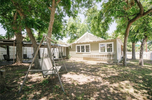 back of house with fence