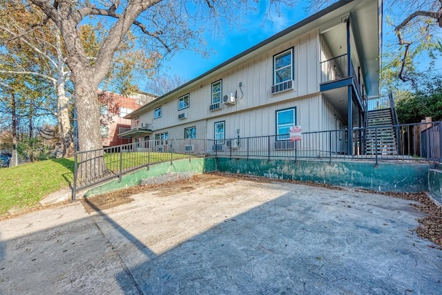 exterior space featuring a yard and cooling unit