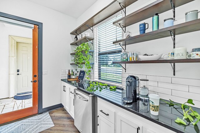 bar with white cabinetry and dark wood-type flooring