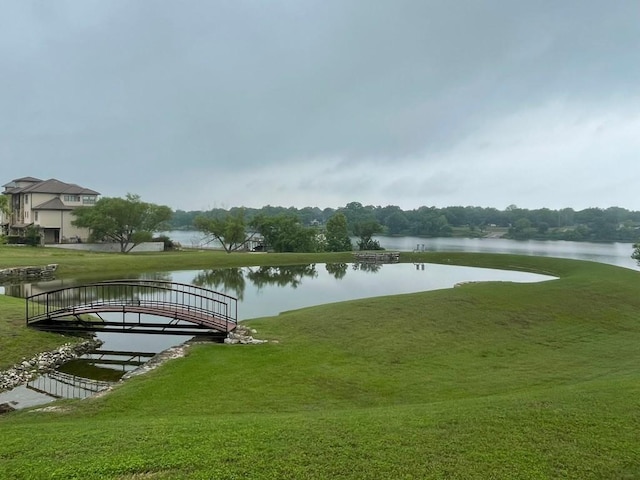 exterior space with a yard and a water view