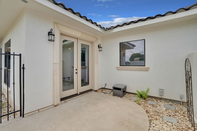 doorway to property featuring french doors and a patio