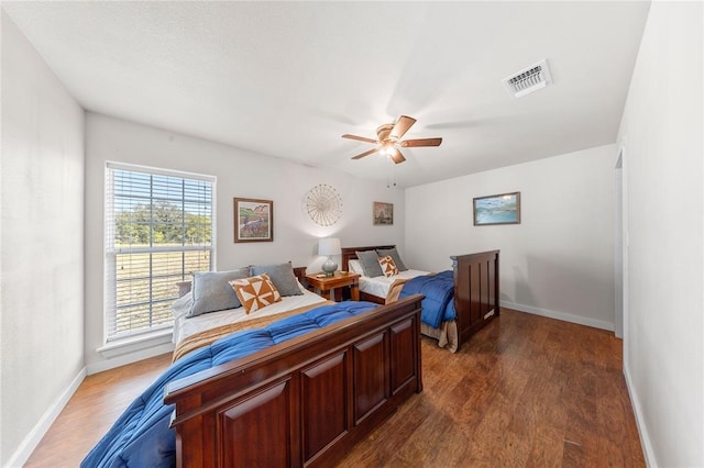 bedroom featuring ceiling fan and dark hardwood / wood-style flooring