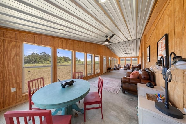 sunroom / solarium with ceiling fan and vaulted ceiling