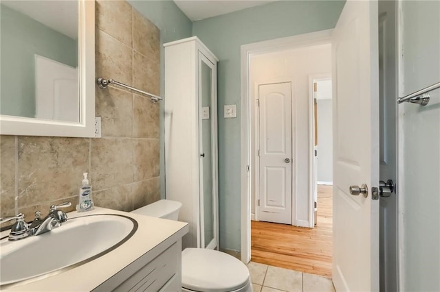 bathroom featuring vanity, toilet, and wood-type flooring