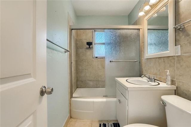 full bathroom with tile patterned floors, vanity, toilet, and tiled shower / bath