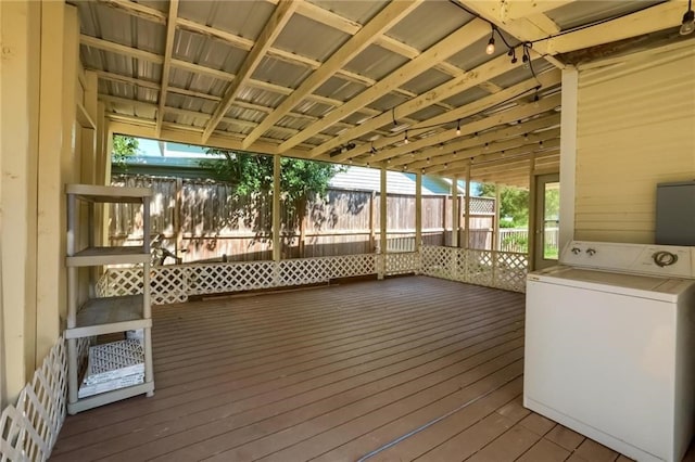 wooden deck featuring washer / dryer