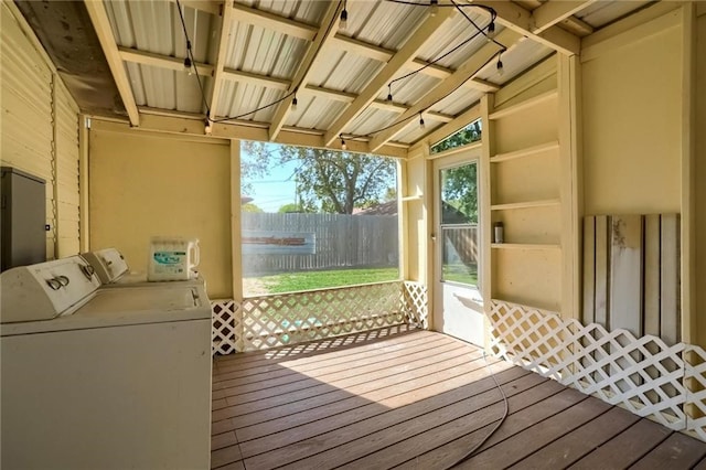 exterior space featuring lofted ceiling and washing machine and clothes dryer