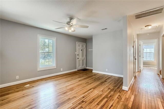 spare room with ceiling fan and light hardwood / wood-style flooring