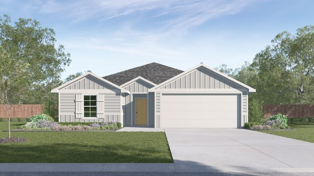 view of front of property featuring a garage and a front yard