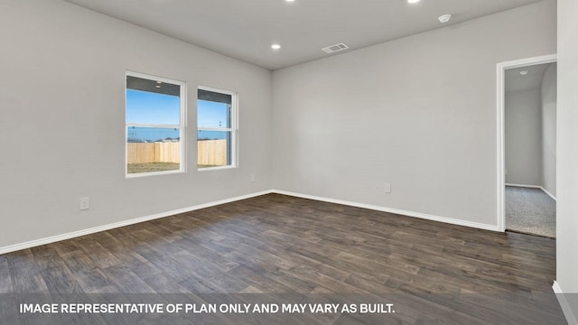 empty room featuring dark hardwood / wood-style flooring