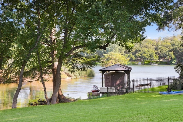 view of dock featuring a yard and a water view