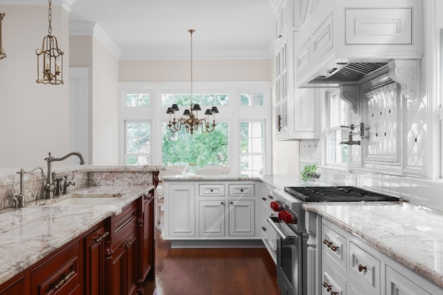 kitchen featuring decorative light fixtures, stainless steel appliances, plenty of natural light, and sink