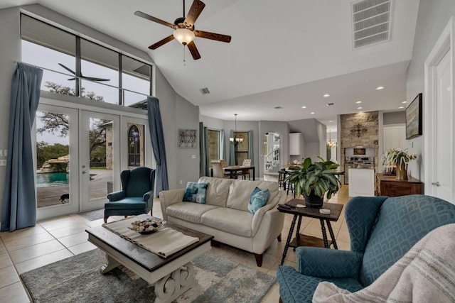 living room with ceiling fan, french doors, light tile patterned floors, and high vaulted ceiling