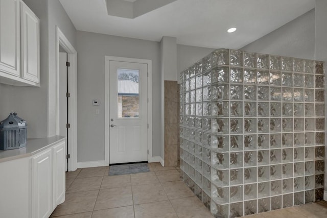 entrance foyer with light tile patterned floors