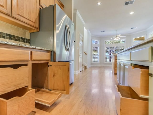 kitchen with decorative backsplash, stainless steel fridge, light wood-type flooring, ceiling fan, and crown molding