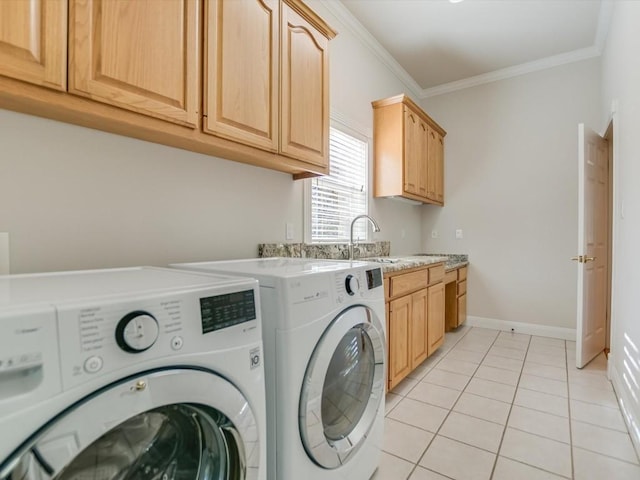 clothes washing area with cabinets, ornamental molding, sink, washer and dryer, and light tile patterned floors