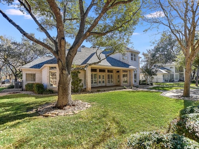 back of house with a yard