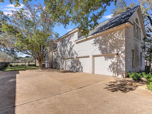 view of side of home with a garage