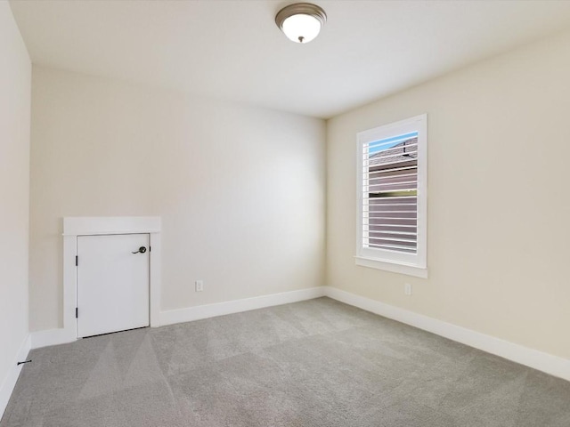 empty room featuring light colored carpet