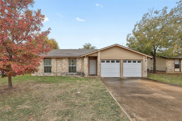 single story home featuring a garage and a front lawn