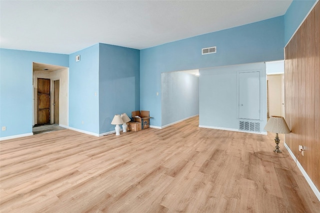 unfurnished living room featuring light hardwood / wood-style flooring