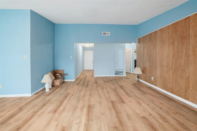 unfurnished living room with light hardwood / wood-style flooring