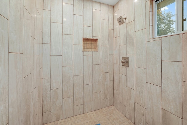 bathroom with tiled shower