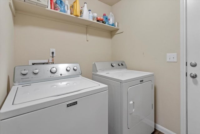 clothes washing area with washer and dryer