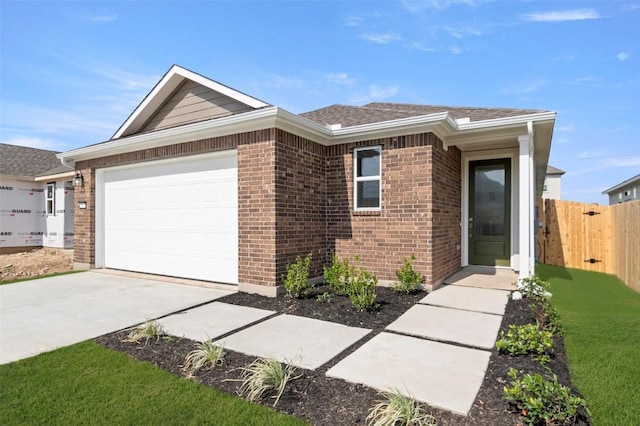 1117 Yaupon Holly Dr, Georgetown, TX 78628 - single story home with concrete driveway, an attached garage, and brick siding