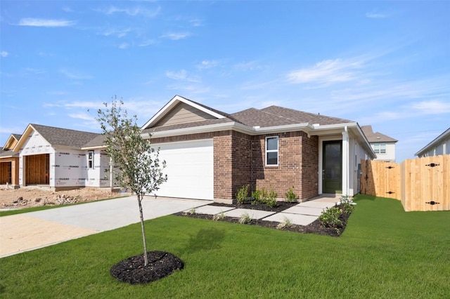 1117 Yaupon Holly Dr, Georgetown, TX 78628 - ranch-style house with brick siding, fence, a garage, concrete driveway, and a front lawn