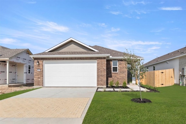 1117 Yaupon Holly Dr, Georgetown, TX 78628 - single story home with an attached garage, decorative driveway, brick siding, and a front yard