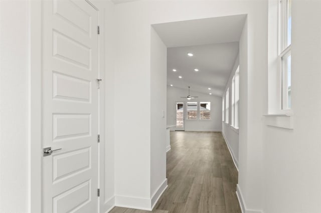1117 Yaupon Holly Dr, Georgetown, TX 78628 - hallway featuring lofted ceiling, baseboards, recessed lighting, and wood finished floors