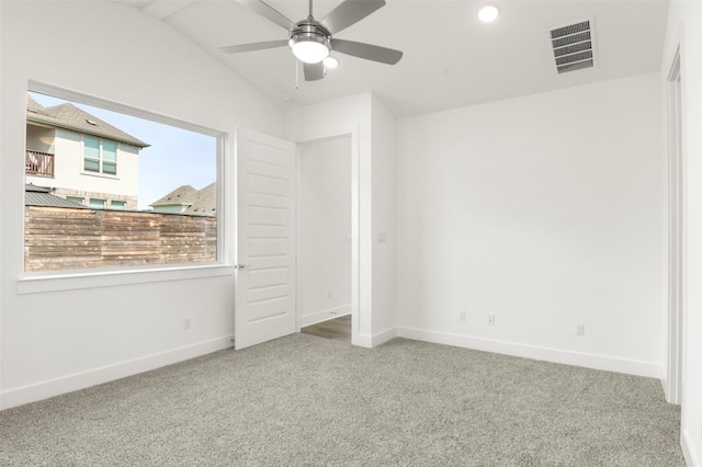 1117 Yaupon Holly Dr, Georgetown, TX 78628 - unfurnished bedroom with vaulted ceiling, carpet flooring, baseboards, and visible vents