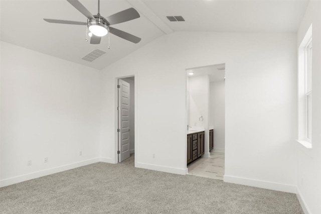 1117 Yaupon Holly Dr, Georgetown, TX 78628 - unfurnished bedroom with light carpet, lofted ceiling, baseboards, and visible vents