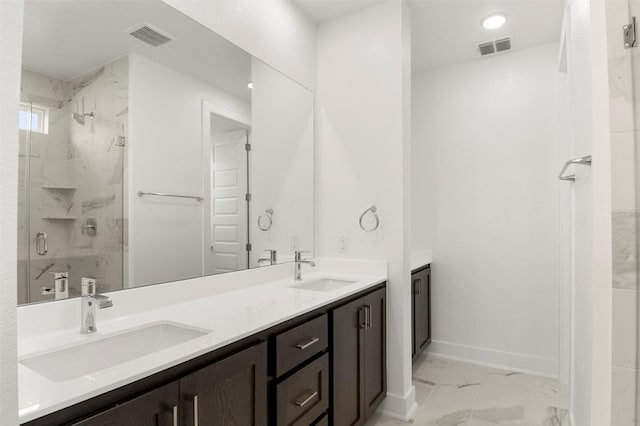 1117 Yaupon Holly Dr, Georgetown, TX 78628 - full bath featuring a sink, marble finish floor, a marble finish shower, and visible vents