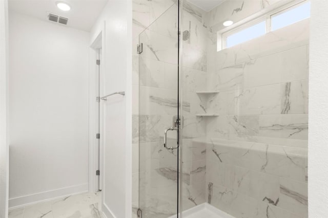 1117 Yaupon Holly Dr, Georgetown, TX 78628 - bathroom featuring marble finish floor, a marble finish shower, baseboards, and visible vents