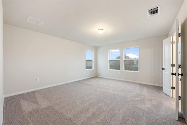 empty room featuring light carpet