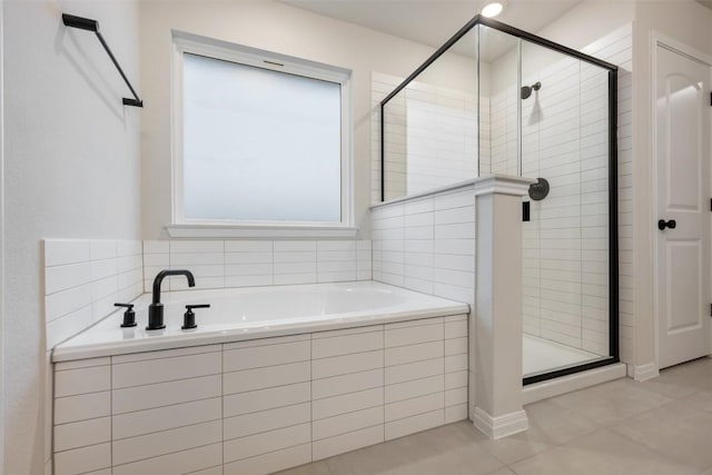 bathroom featuring shower with separate bathtub and tile patterned floors