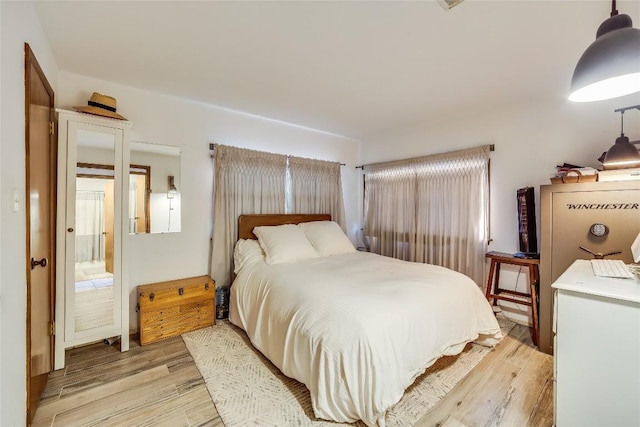 bedroom with light hardwood / wood-style flooring