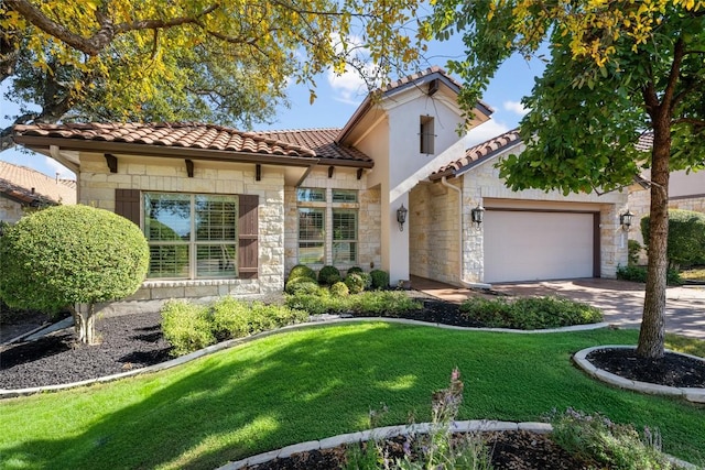 mediterranean / spanish-style house with a front yard and a garage