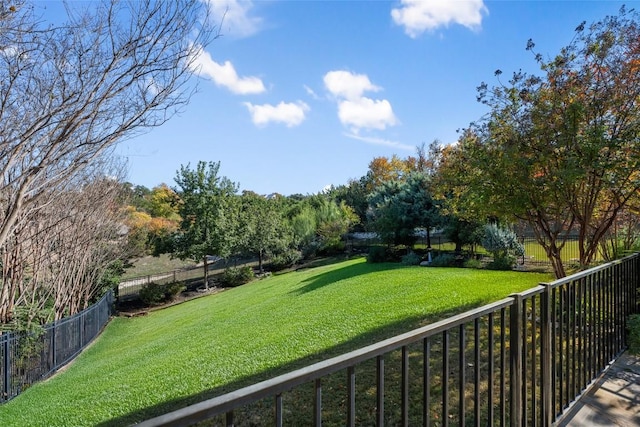 view of property's community with a lawn